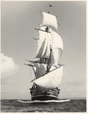 Photograph: Clifford W. Hawkins — New Zealand Maritime Museum, Acc. 2021.29.40 1978 Bounty replica under sail during sea trials, photographed by Clifford W. Hawkins, ca. 1979.